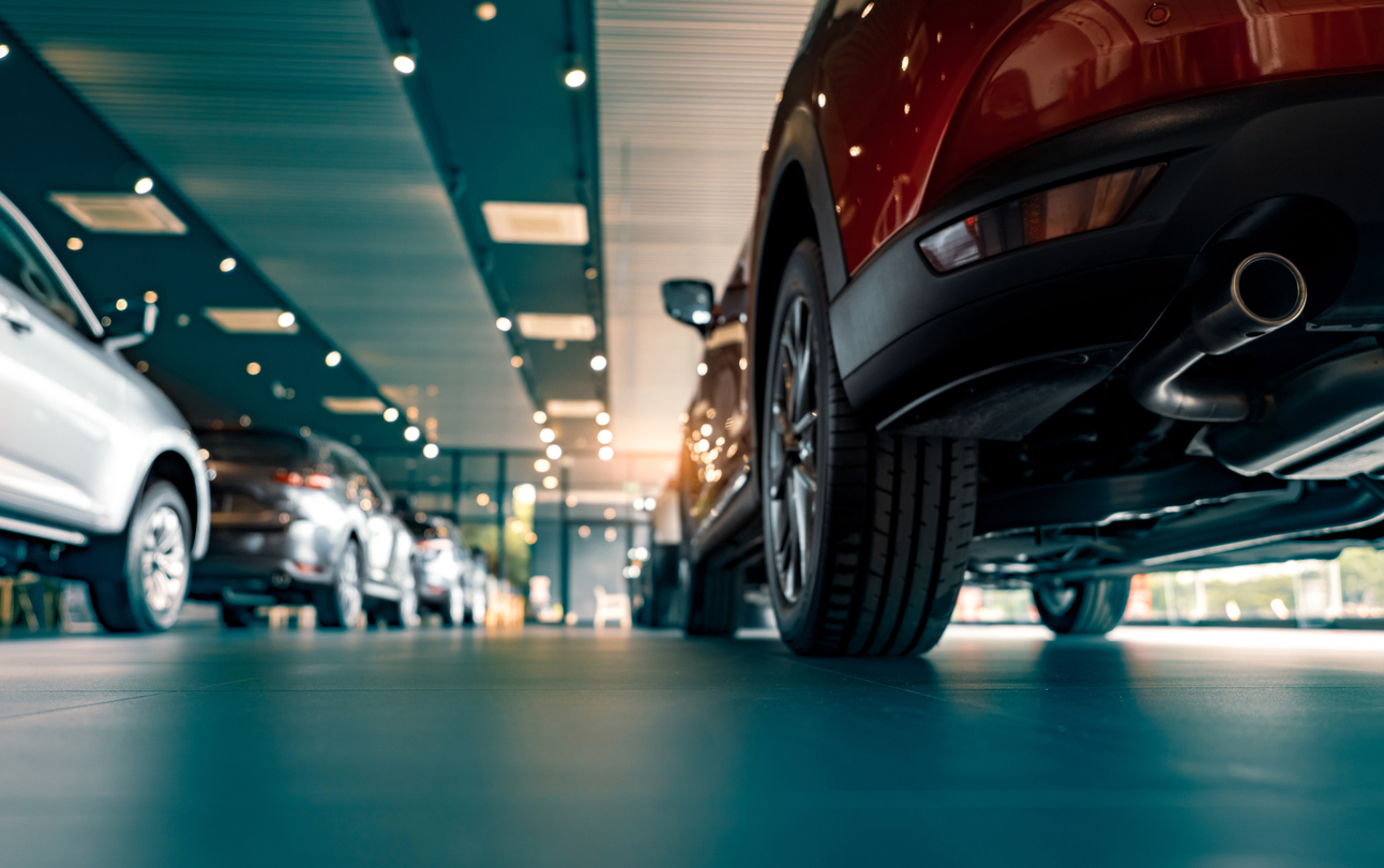 automotive industry = cars lined up in a showroom